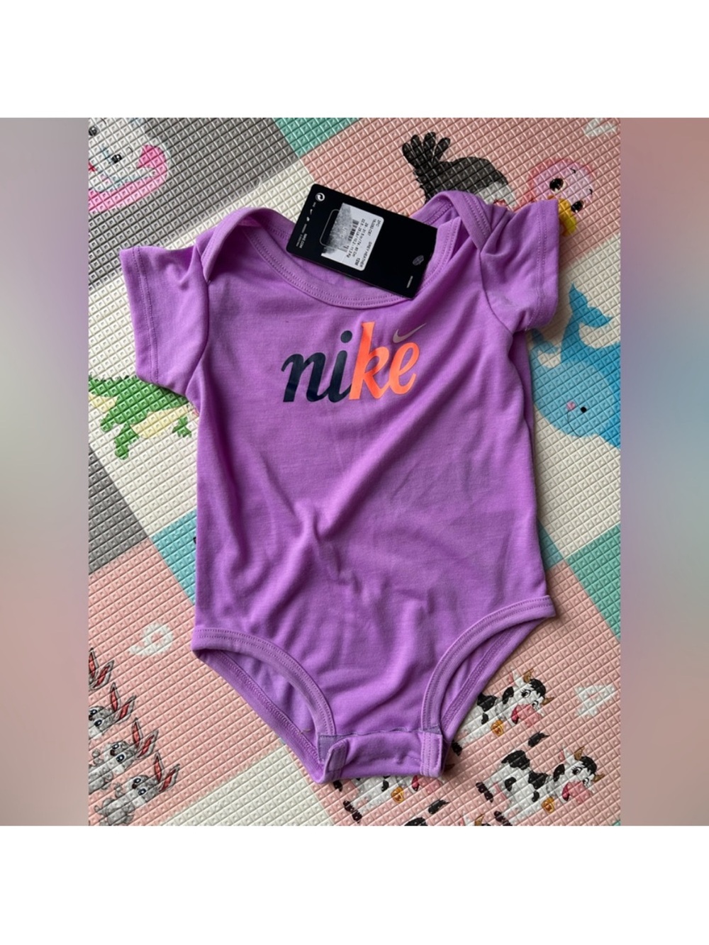 Nike Lavender Baby One-Piece Bodysuit with Orange Accent Logo